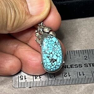Natural Turquoise Kingman Spiderweb Silver Pendant. 6g